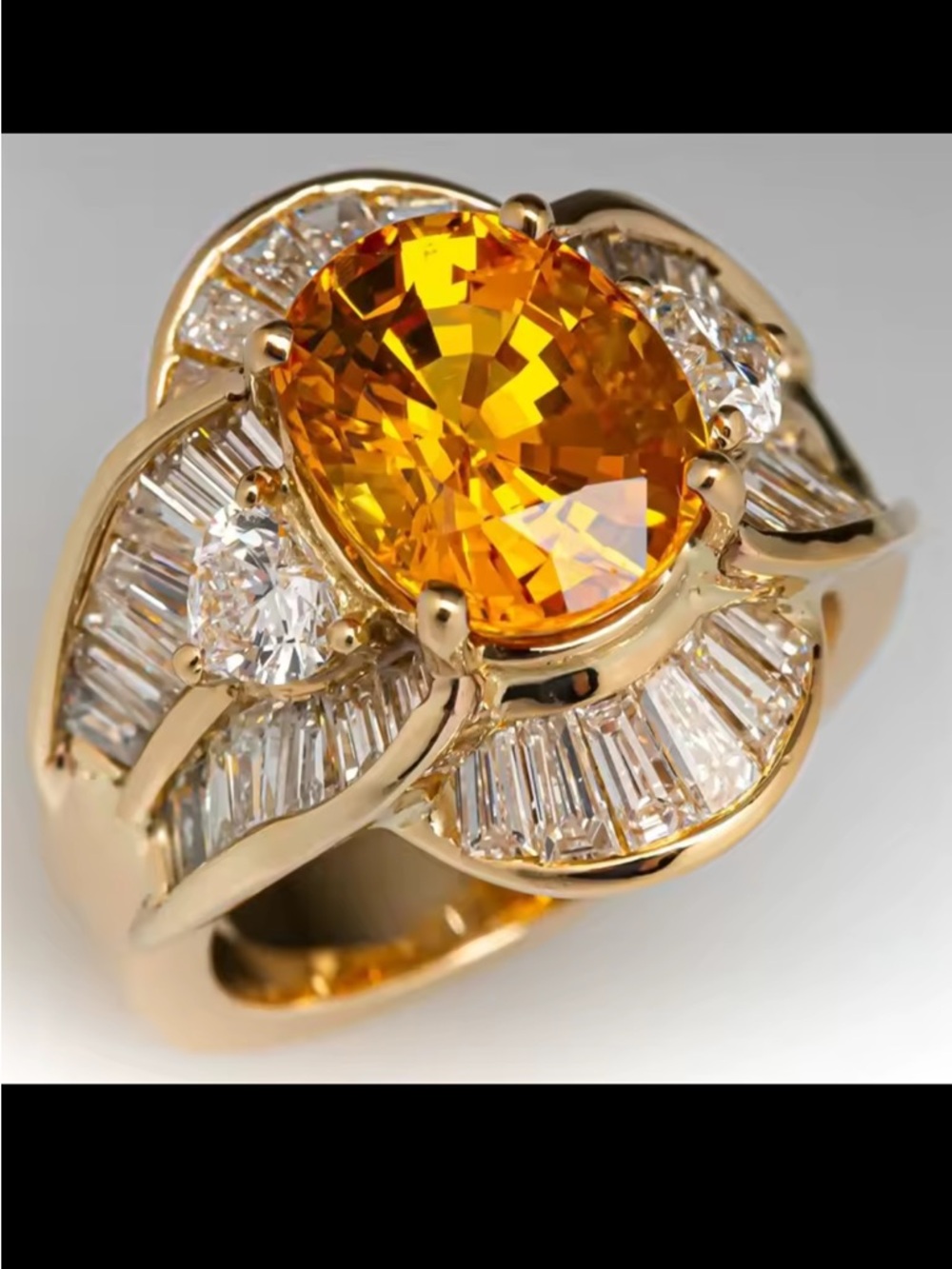 Gold Ring with Oval Orange Center Stone and Diamond Accents